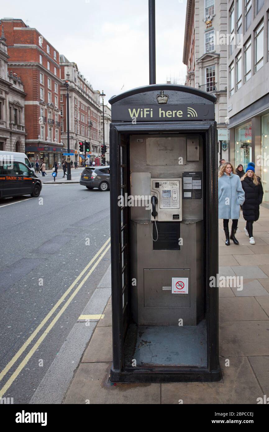 Old school phone booth offering modern WiFi Stock Photo