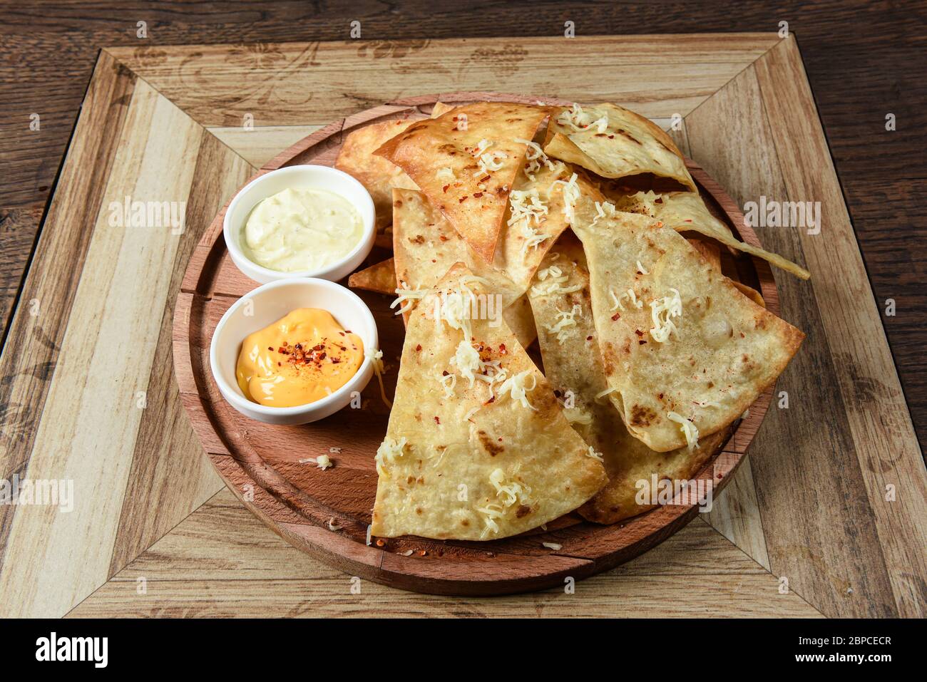 crispy fresh tortilla chips with sauces Stock Photo