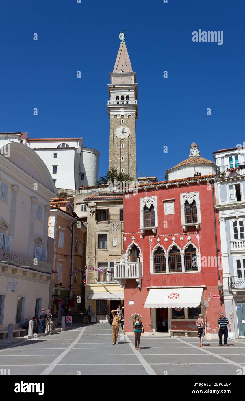 PIRAN, Slovenia - April 25, 2013: The architectures of Tartini square on the side facing the St George's church bell tower Stock Photo