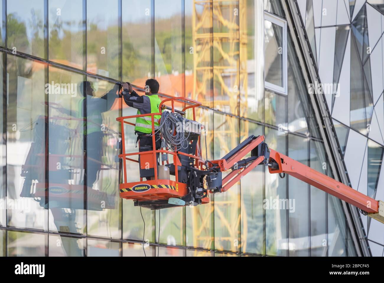 Zagreb, Croatia - 16 April, 2020 : Workers working on the construction site of the new building for cable car that goes to the top of the Medvednica N Stock Photo