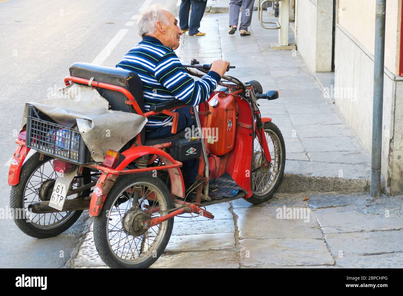 An old disability scooter in Palermo, Sicily. Stock Photo