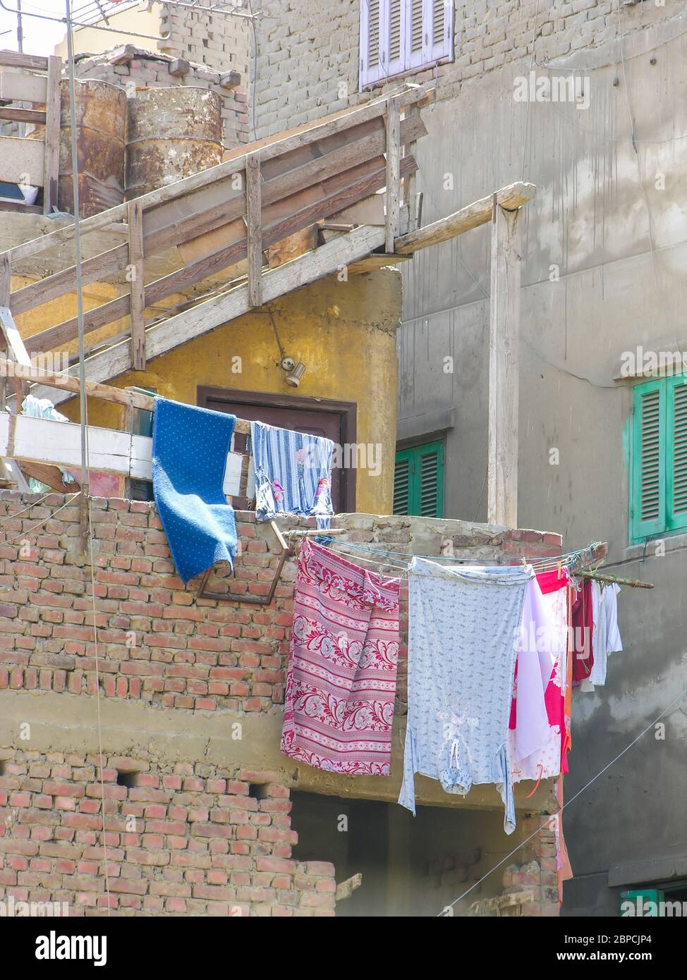 Clothesline between buildings hires stock photography and images Alamy