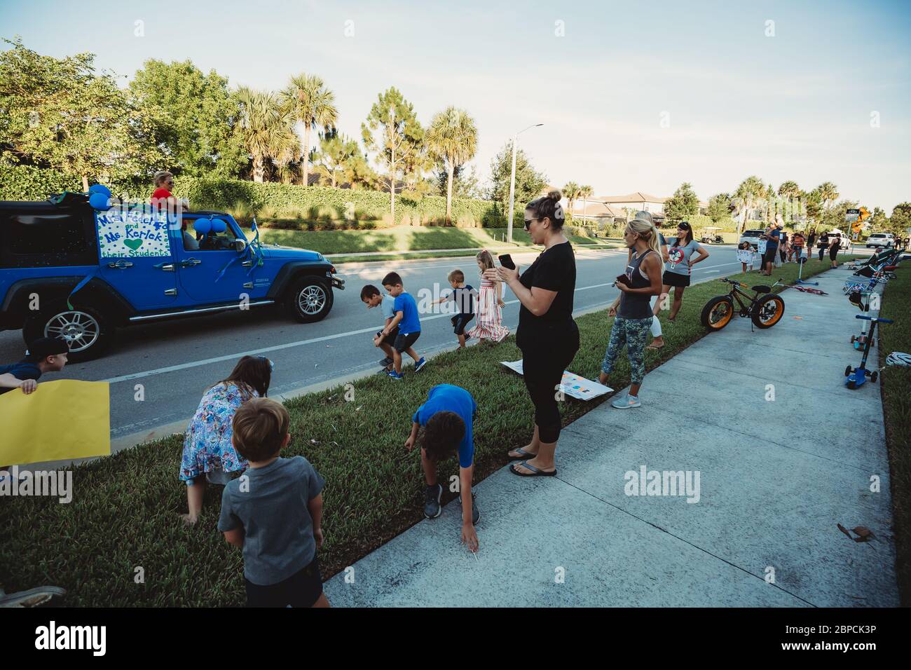 Students collect candy during Quarantine parade Stock Photo Alamy