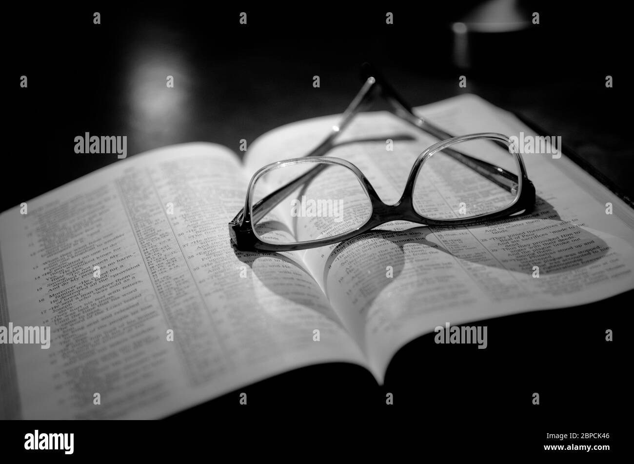 Glasses on Bible Stock Photo Alamy