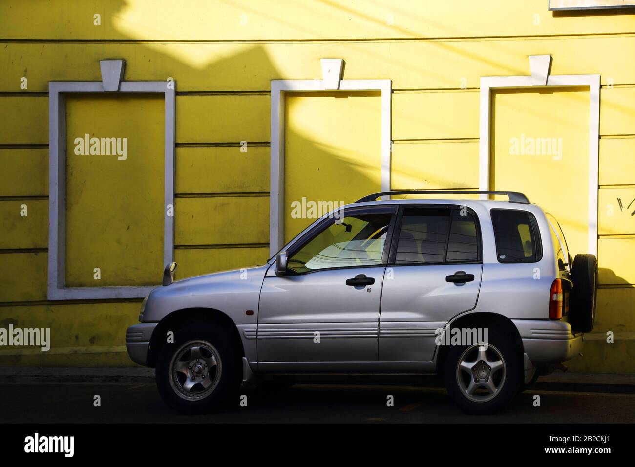 St Grenada Four Wheel Drive Car Parked by Yellow Building