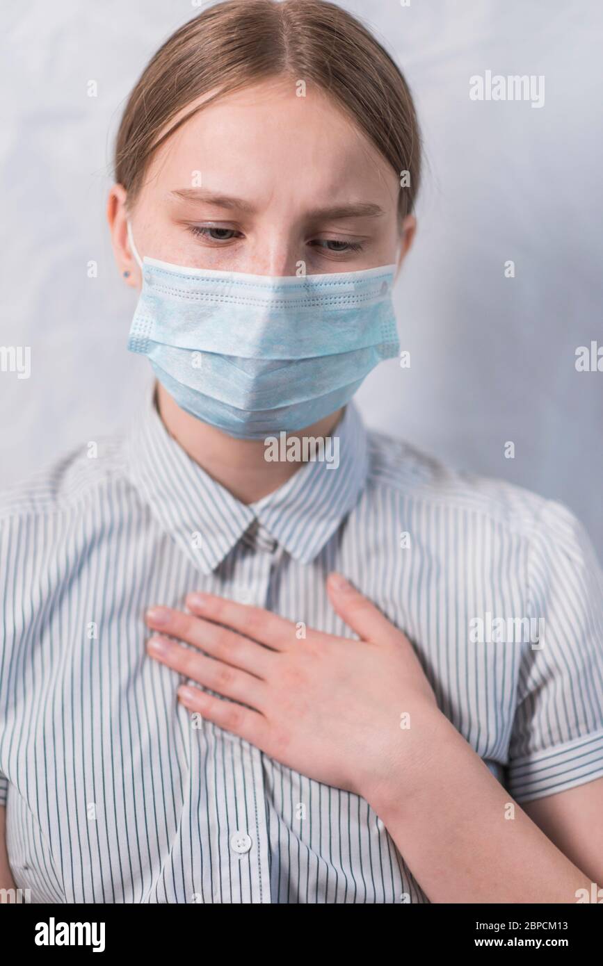 Closeup, teenage girl, feeling sick cough and sore throat and pain