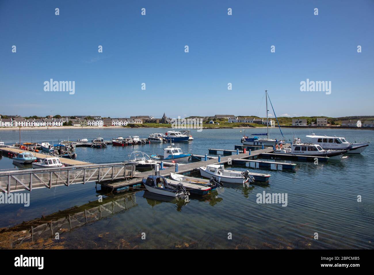 Leisure boats moored at the pontoons in Port Ellen, Isle of Islay Stock Photo