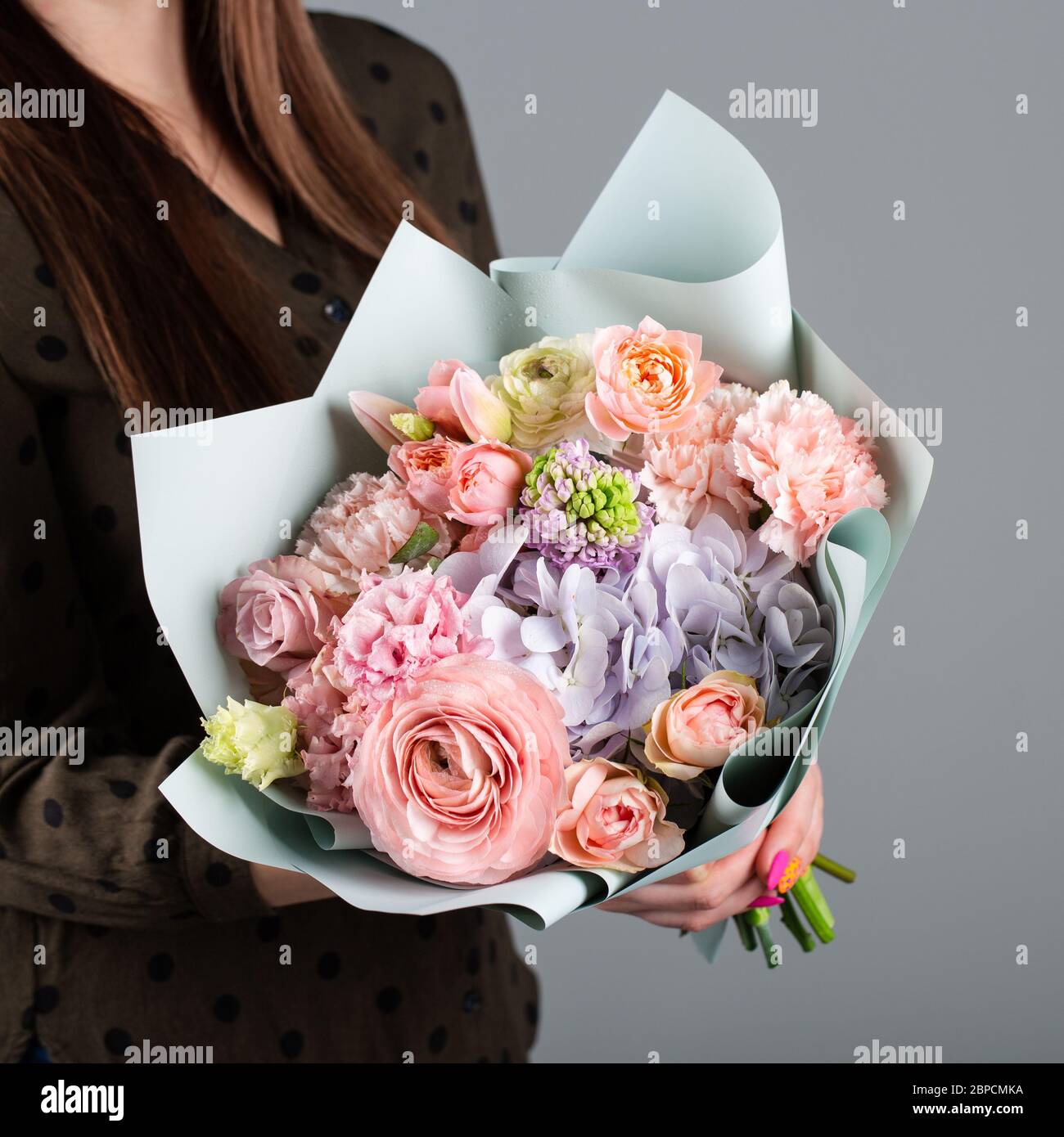 Beautiful bouquet of flowers. Roses, hydrangea, tulip, carnation. Stock Photo