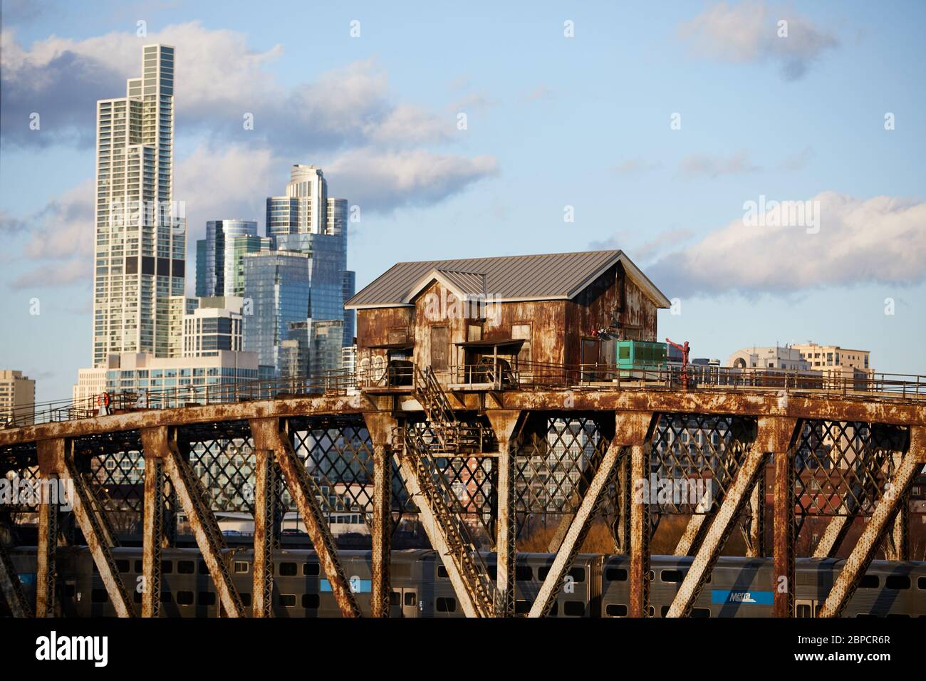 A tender house sits atop a railway bridge for passing trains just south of downtown Chicago Stock Photo