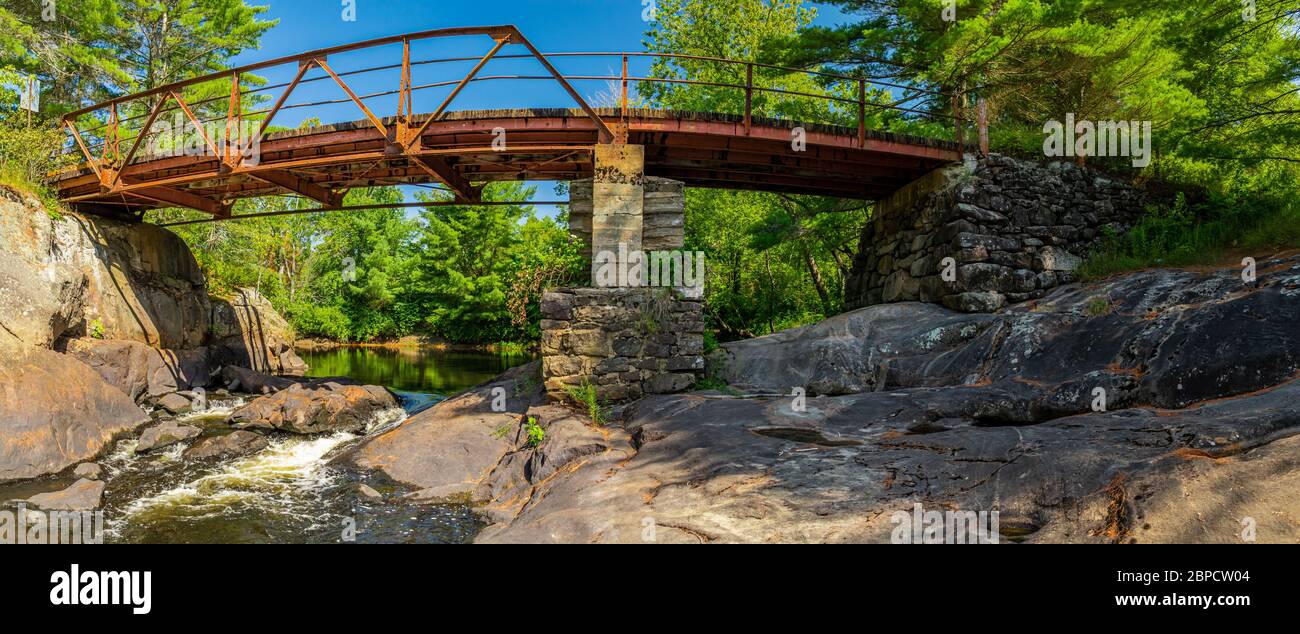 Victoria Falls Conservation Area  showing main falls area, two tone textured rocks and green forest on a sunny summer gorgeous day Stock Photo