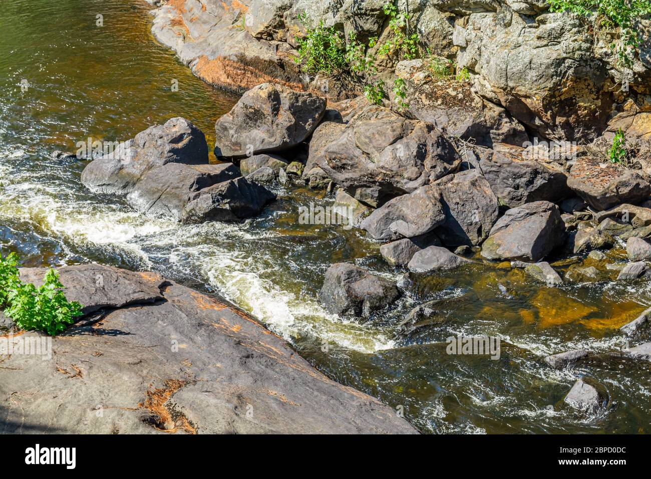 Victoria Falls Conservation Area  showing main falls area, two tone textured rocks and green forest on a sunny summer gorgeous day Stock Photo