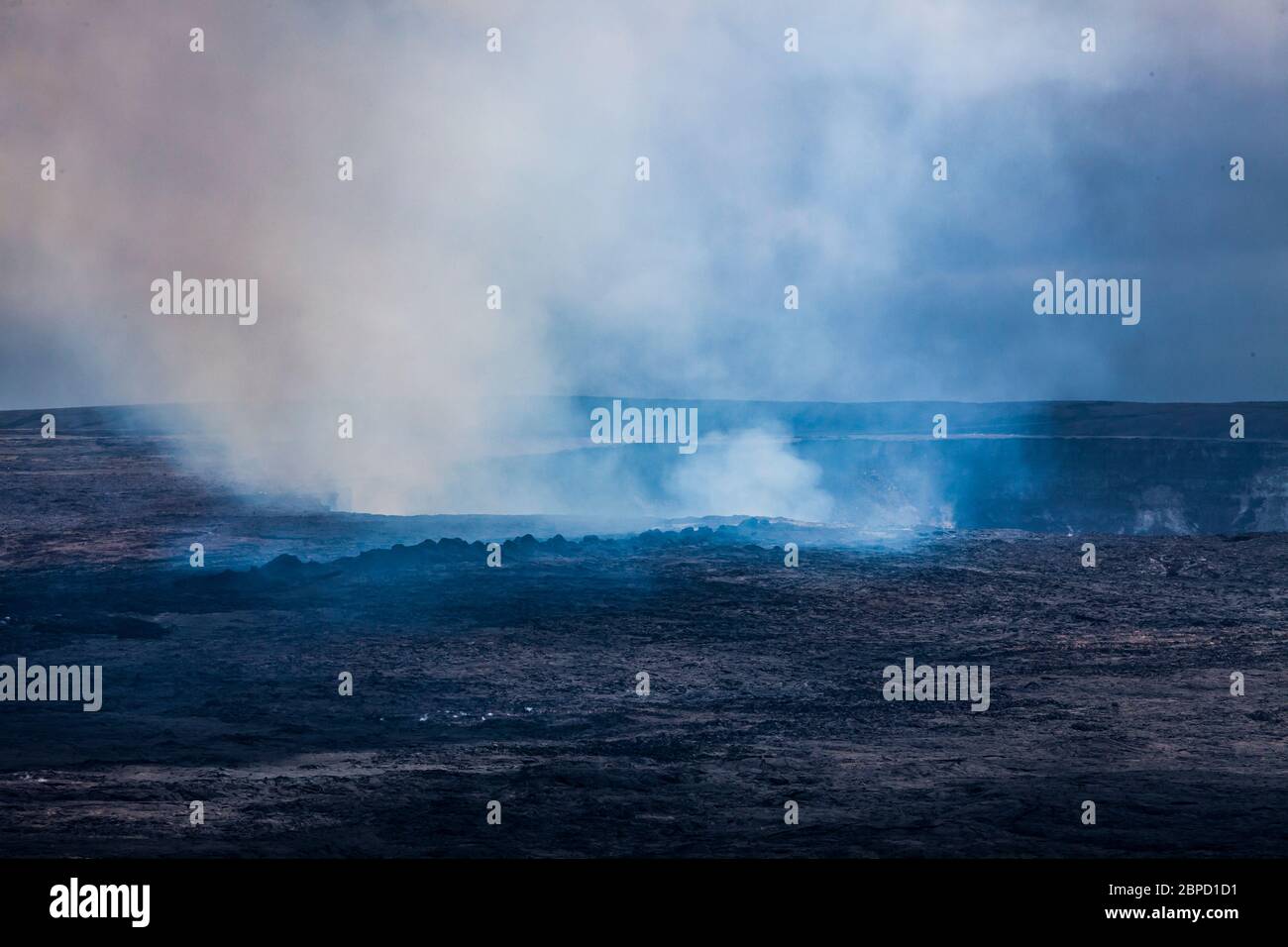 Steam and gases drift up and out of the bubbling lava lake in Kilauea Caldera / Halema'uma'u crater April 2017, Hawai'i Volcanoes National Park, Hawai Stock Photo