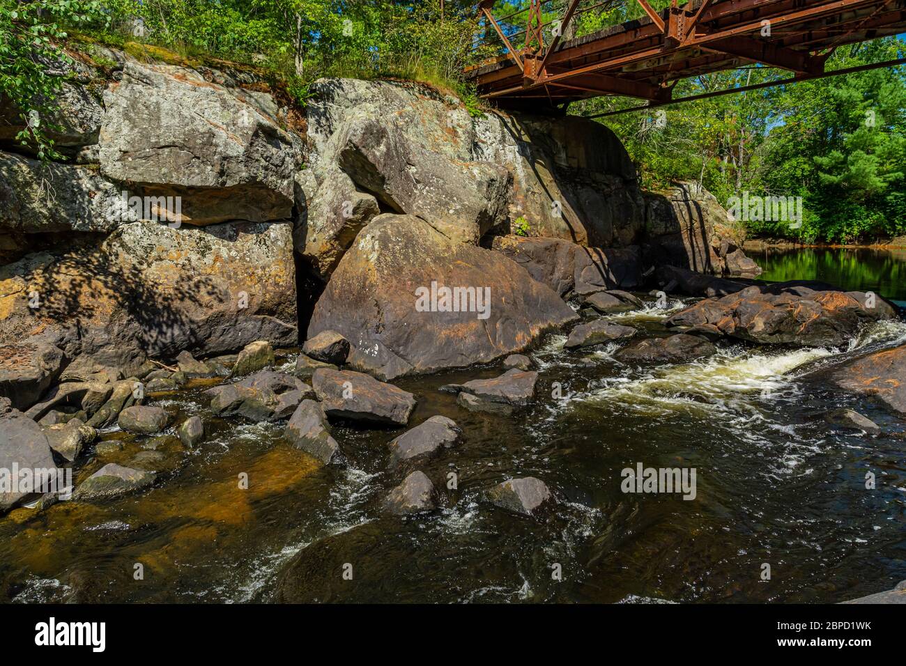 Victoria Falls Conservation Area  showing main falls area, two tone textured rocks and green forest on a sunny summer gorgeous day Stock Photo