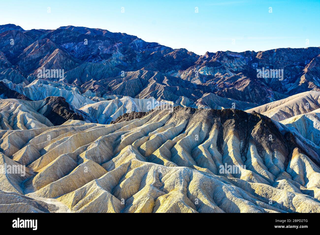 Volcanic rock and limestone erosion creating gullies Stock Photo - Alamy