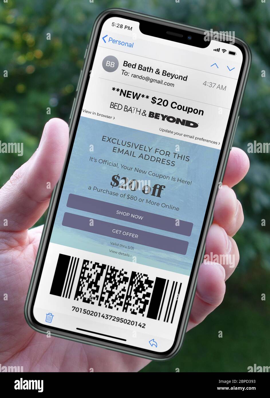 Photo illustration of a Bed Bath & Beyond coupon arriving on a smartphone via email (includes scanable QR code). Bed Bath & Beyond Inc. is an American chain of domestic merchandise retail stores that operates stores in the United States, Canada, and Mexico. It was founded in 1971. Stock Photo