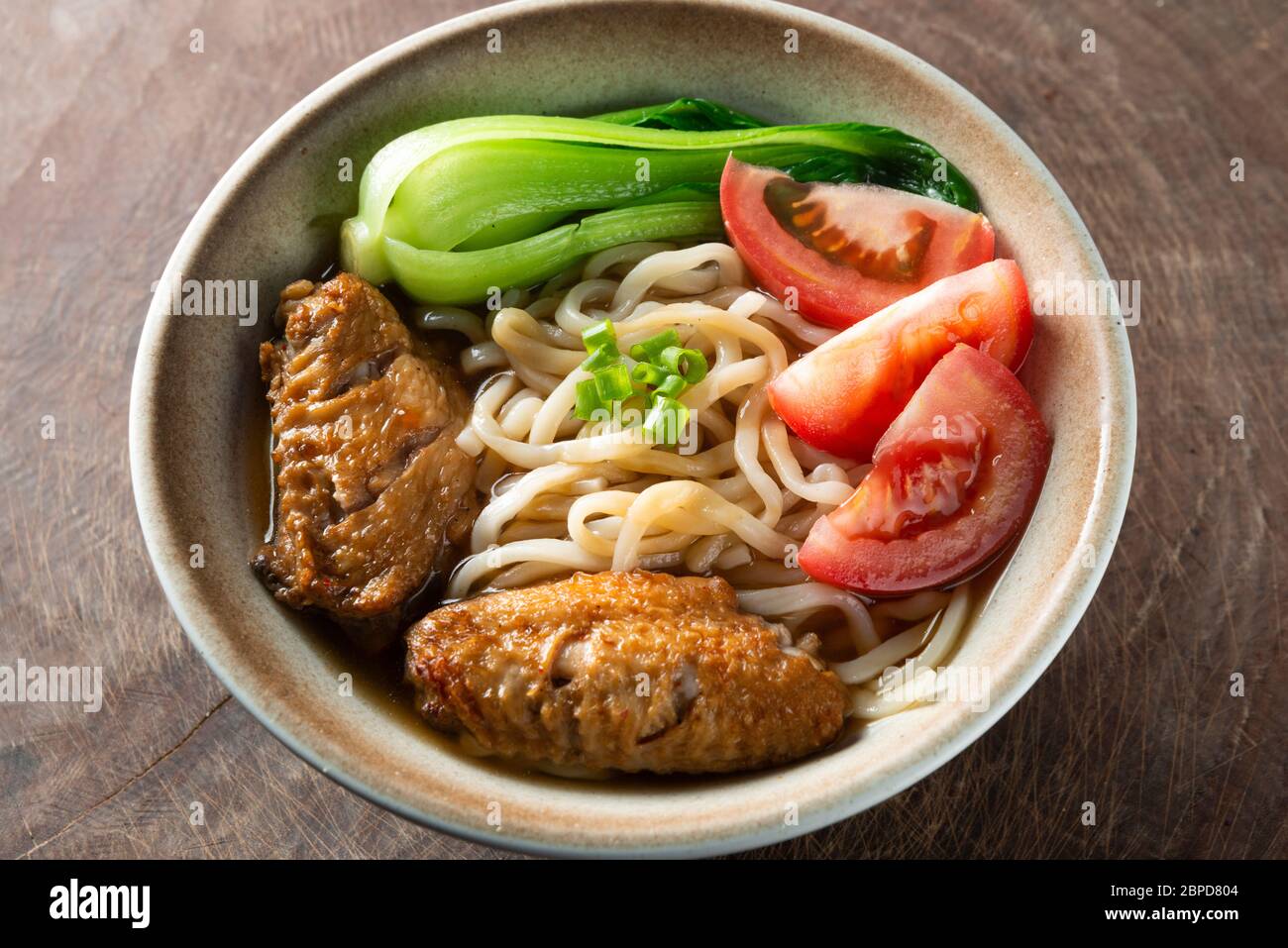 Delicious Chinese noodles with chicken wings Stock Photo Alamy