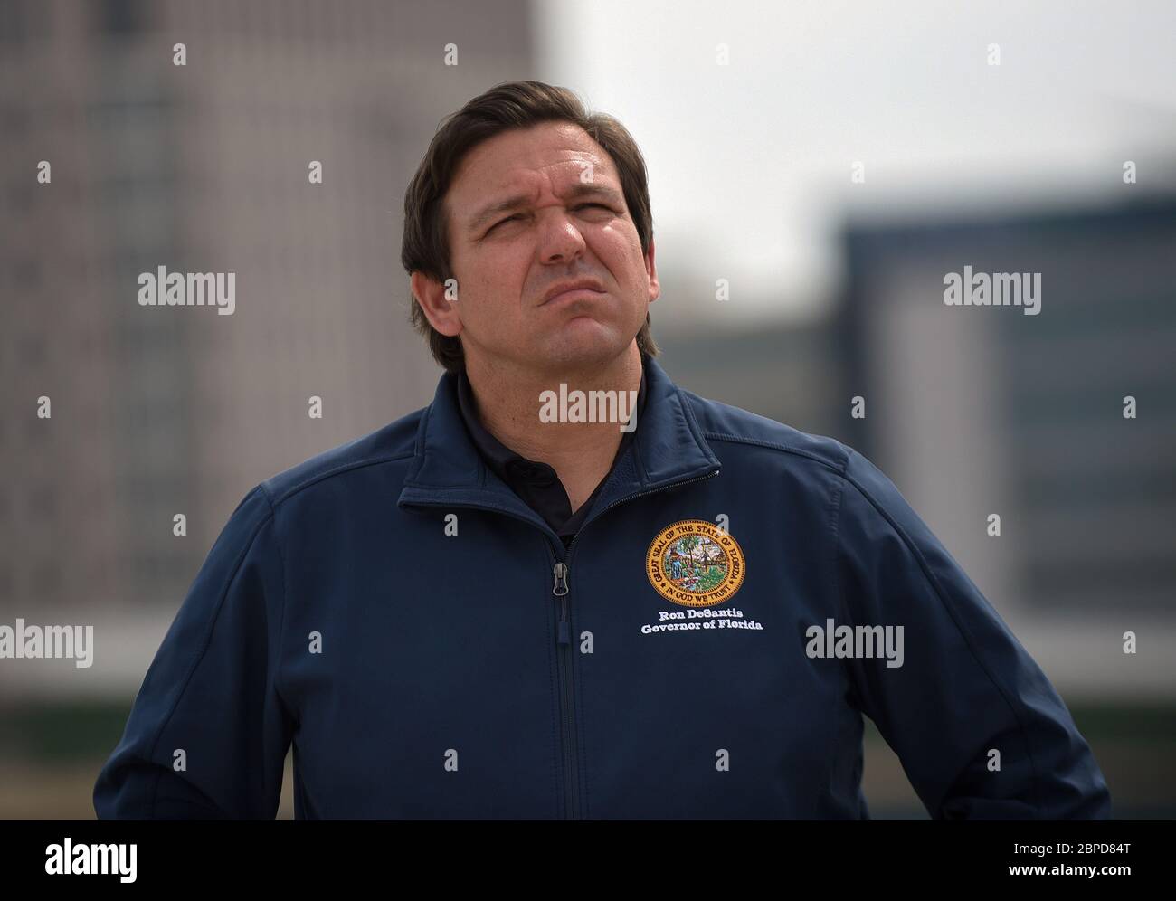 May 18, 2020 - Orlando, Florida, United States - Florida Gov. Ron DeSantis looks on at a news conference on May 18, 2020 at the newly completed I-4 and State Road 408 interchange which will open to traffic tonight in downtown Orlando, Florida. DeSantis explained that progress on the 21-mile I-4 Ultimate Project was expedited at his direction due to the decrease in traffic during the coronavirus crisis. (Paul Hennessy/Alamy) Stock Photo