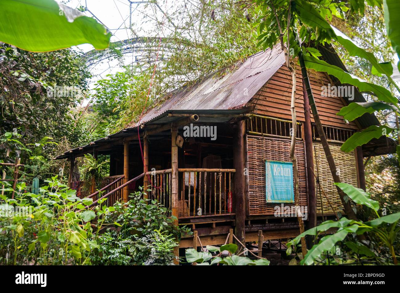 The Malaysian House, a traditional home from a Sabah, Borneo kampong in the Rainforest Biome of the Eden Project, Cornwall, Great Britain Stock Photo