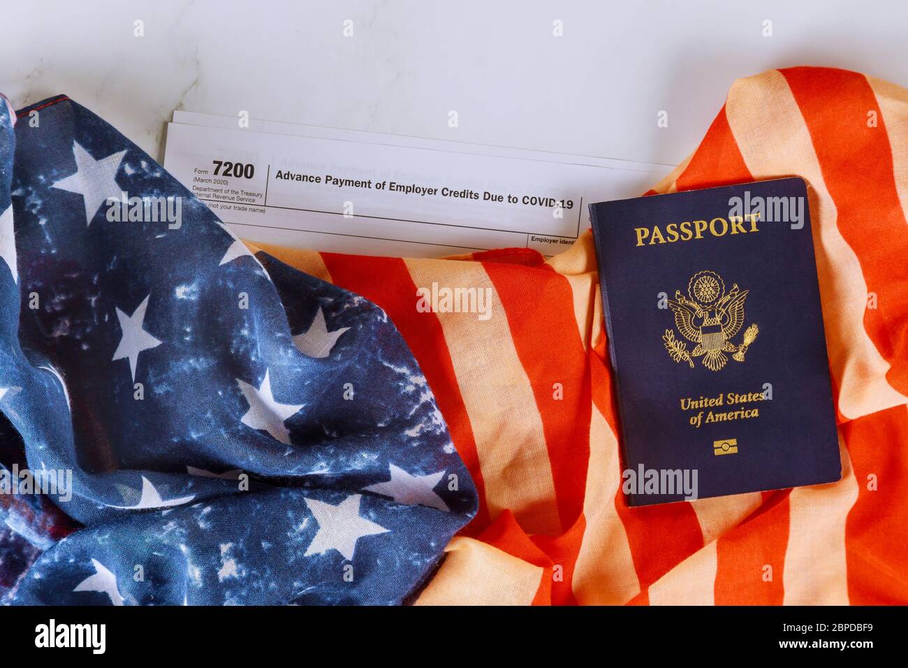 American flag, Form 7200, Advance Payment of Employer Credits Due to COVID-19 on Passport of US Stock Photo