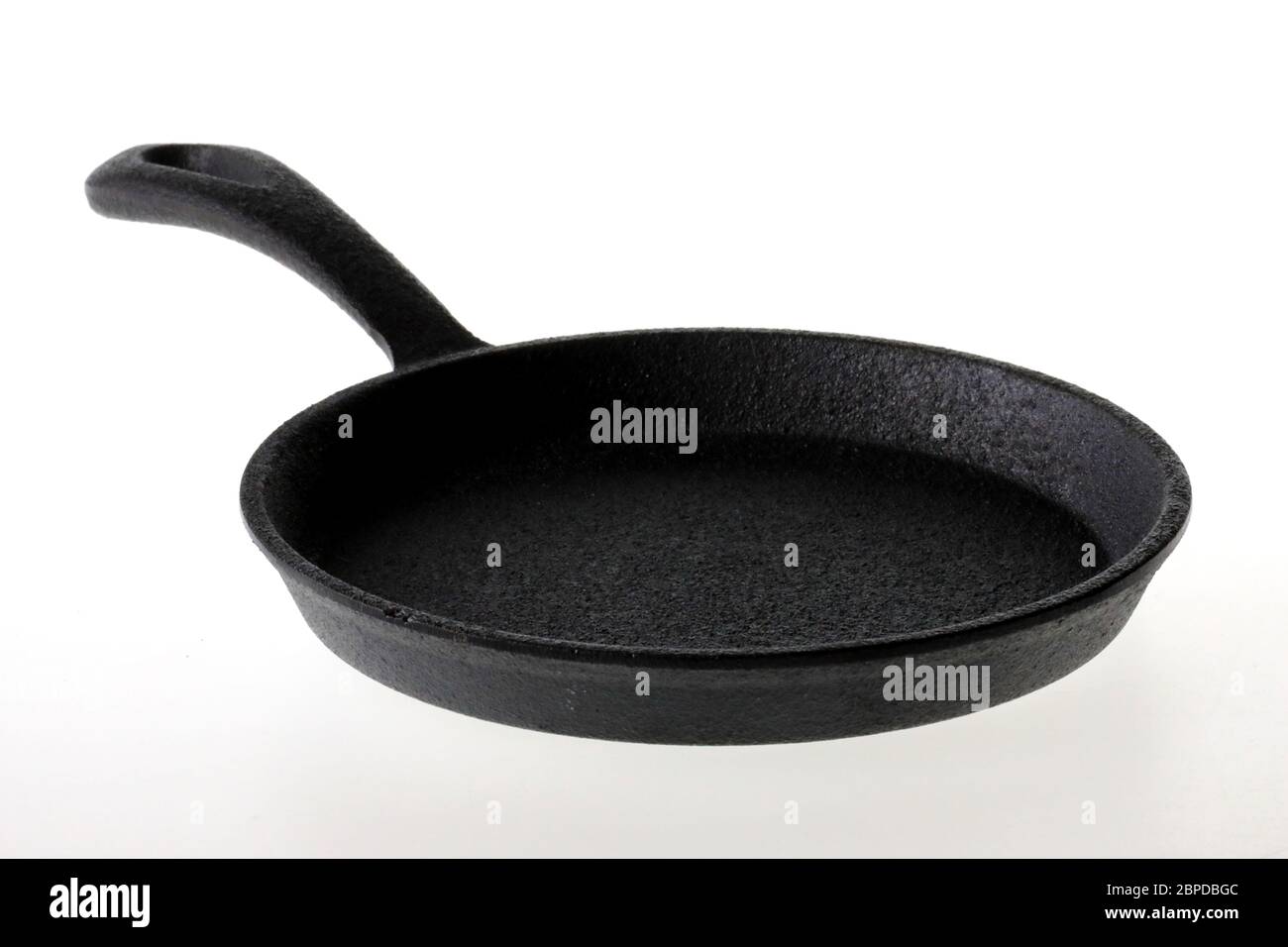 Cast iron frying pan on a white background Stock Photo Alamy
