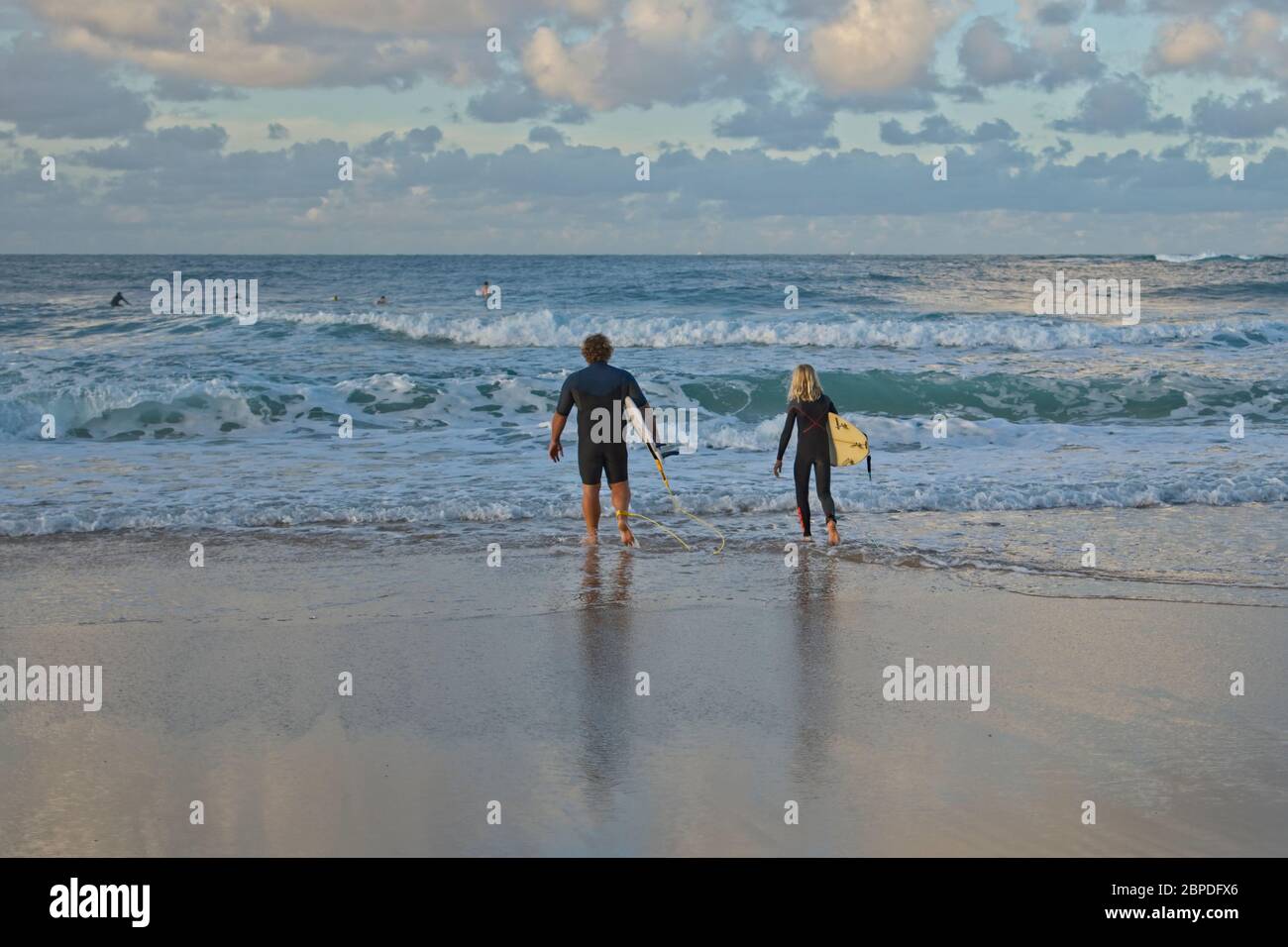 Surfer catching waves on the Sunshine Coast in Australia. Stock Photo