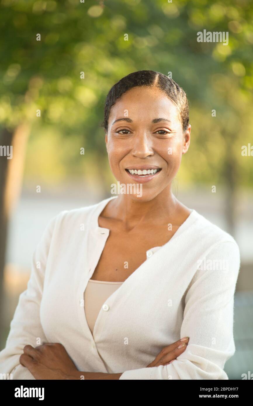 Mature confident African American woman smiling outside. Stock Photo