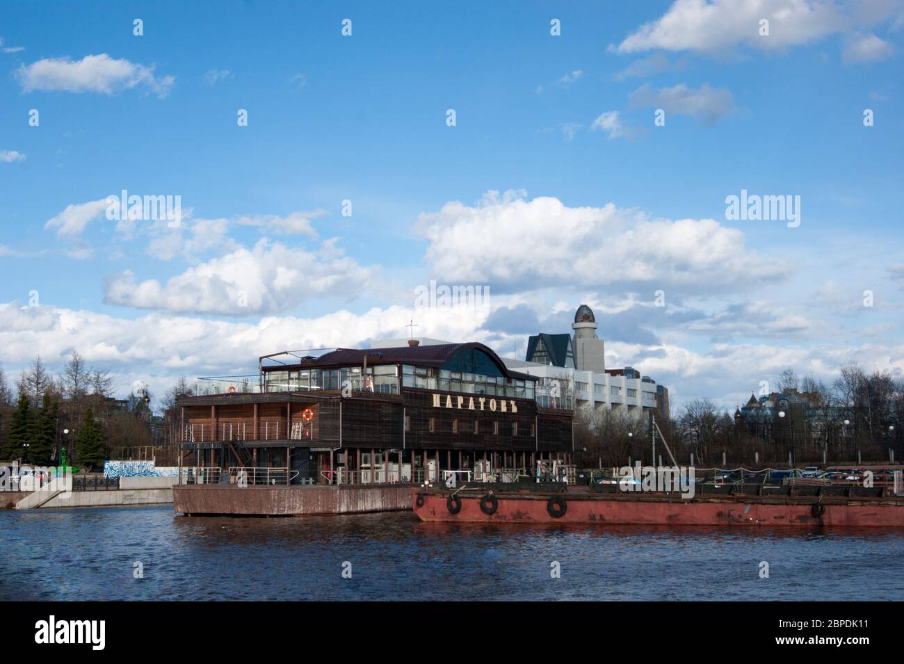 Russia, Arkhangelsk - May 2020. Arkhangelsk sea trade port, a major Russian northern port. Embankment, pier. Spring River and blue sky with white clouds Stock Photo