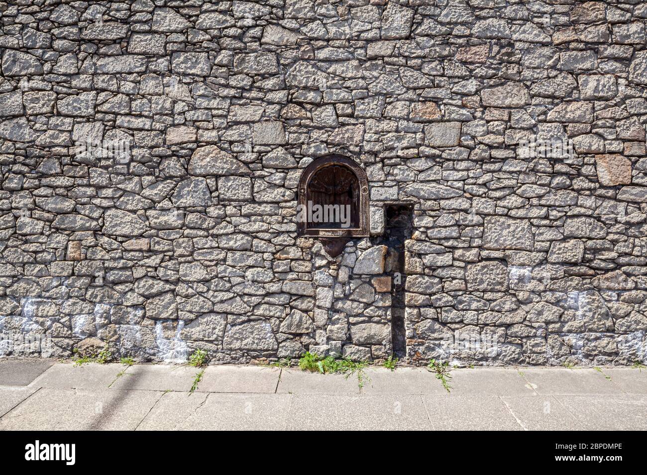 Disused water fountain set into the old stone wall of Nelson Dock, part of the Port of Liverpool, England Stock Photo
