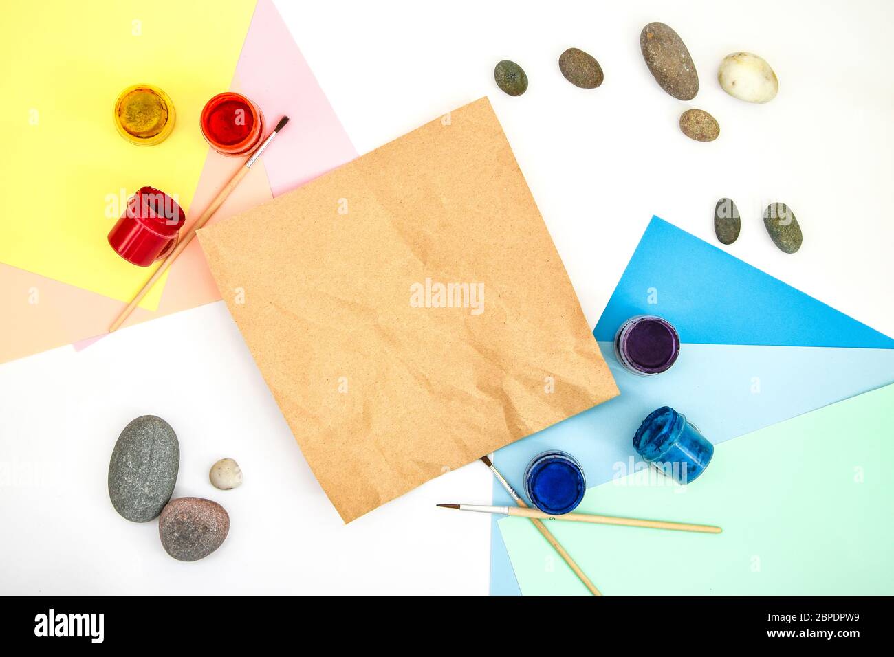 top view of tic tac toe game with stones marked with naughts and ...