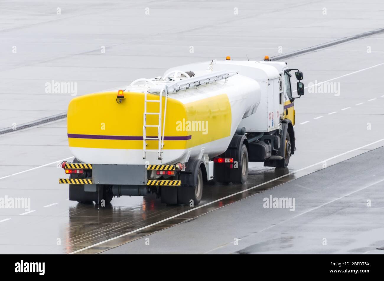 Truck With Fuel Tank On Highway, metal fuel tankers shipping fuel Stock Photo