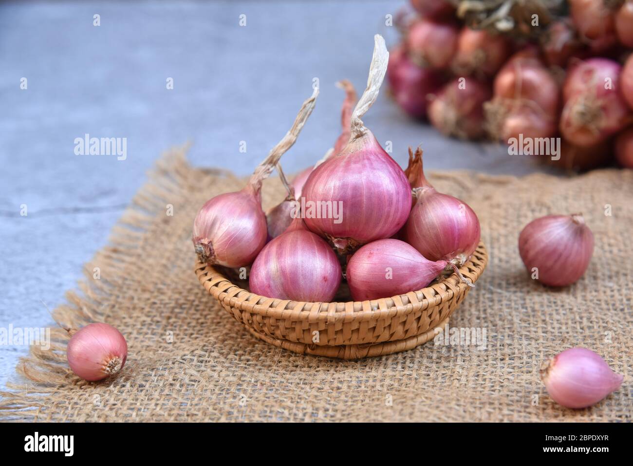 Premium Photo  Thai spicy herb shallot bunch of shallots with root on  wooden table and space on right