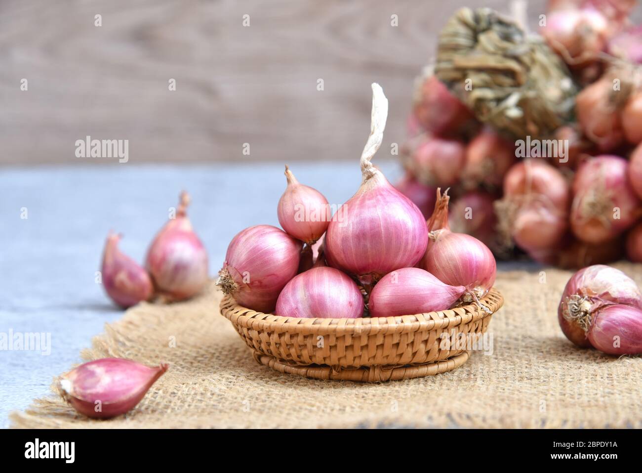 Shallots or red onion, purple shallots on wooden background , fresh shallot  for medicinal products or herbs and spices Thai food made from this raw  shallot 10238227 Stock Photo at Vecteezy