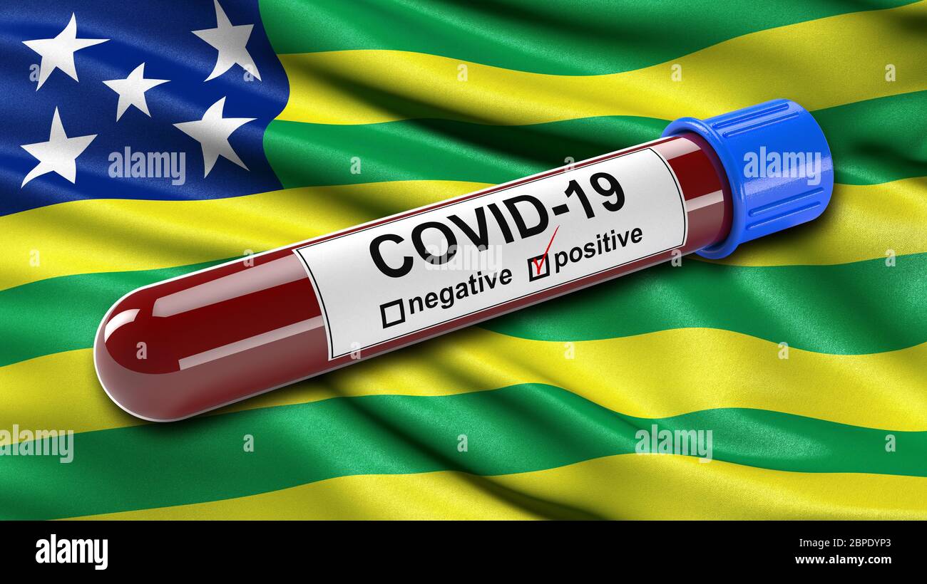Brazilian state flag of Goias waving in the wind with a positive Covid-19 blood test tube.diagnosis of Stock Photo