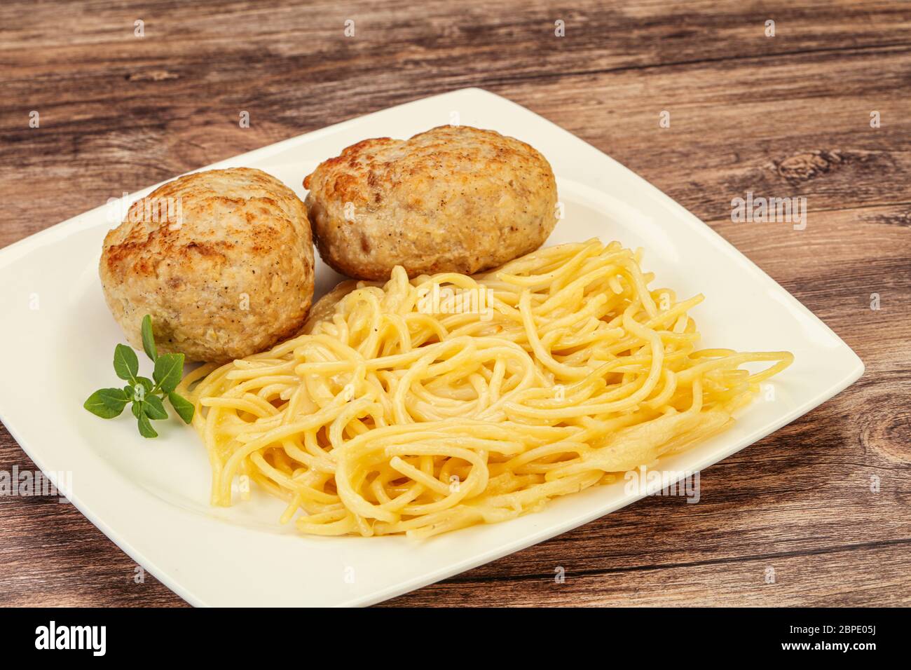 Spaghetti with cheese and homemade chicken cutlet Stock Photo Alamy