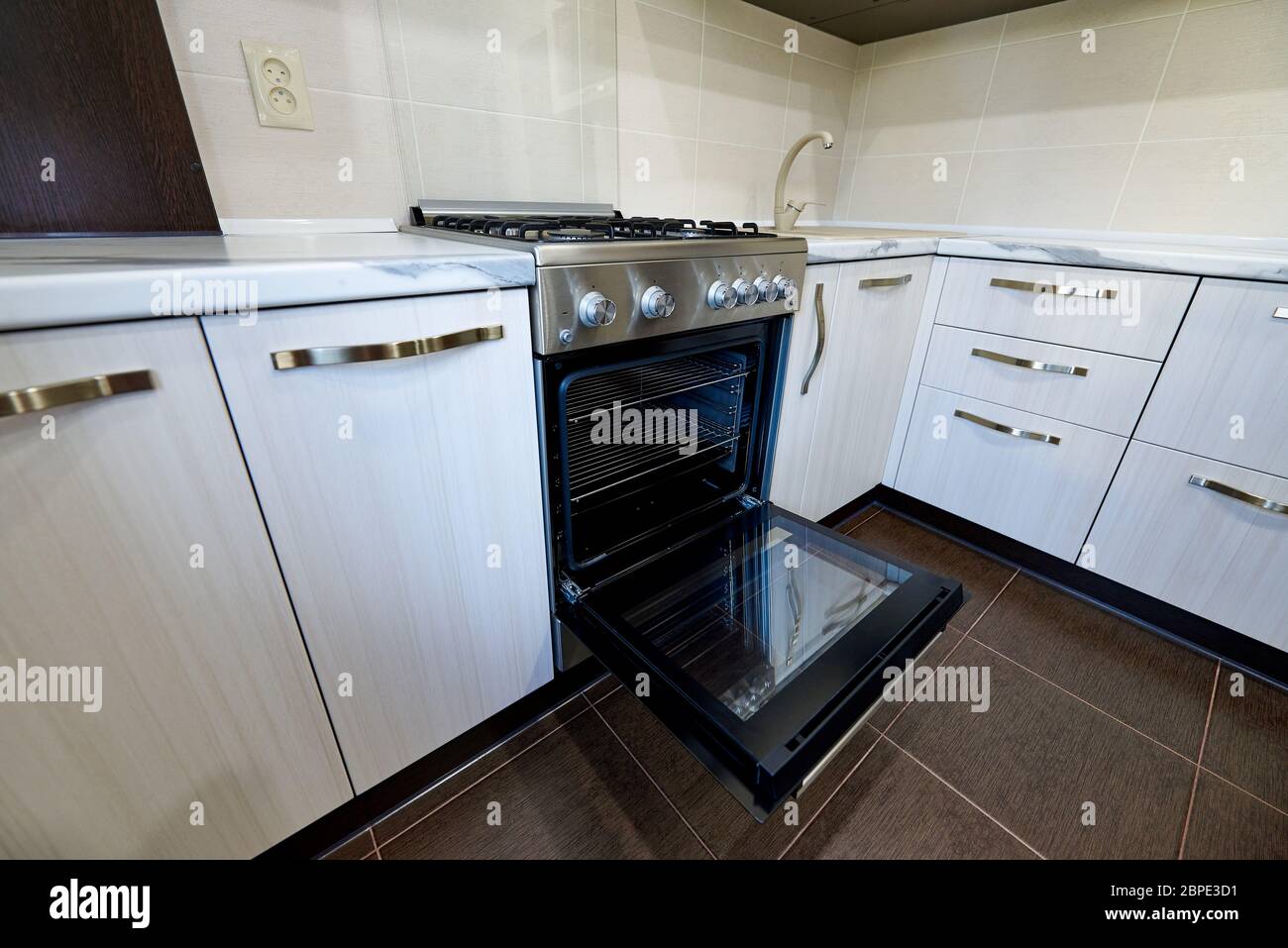 Open oven in an empty kitchen in an apartment Stock Photo Alamy