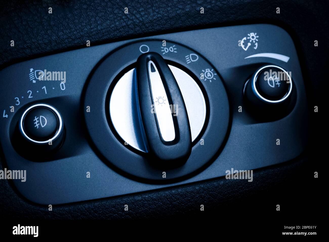 Photo presents interior of car/vehicle, visible headlights switch with