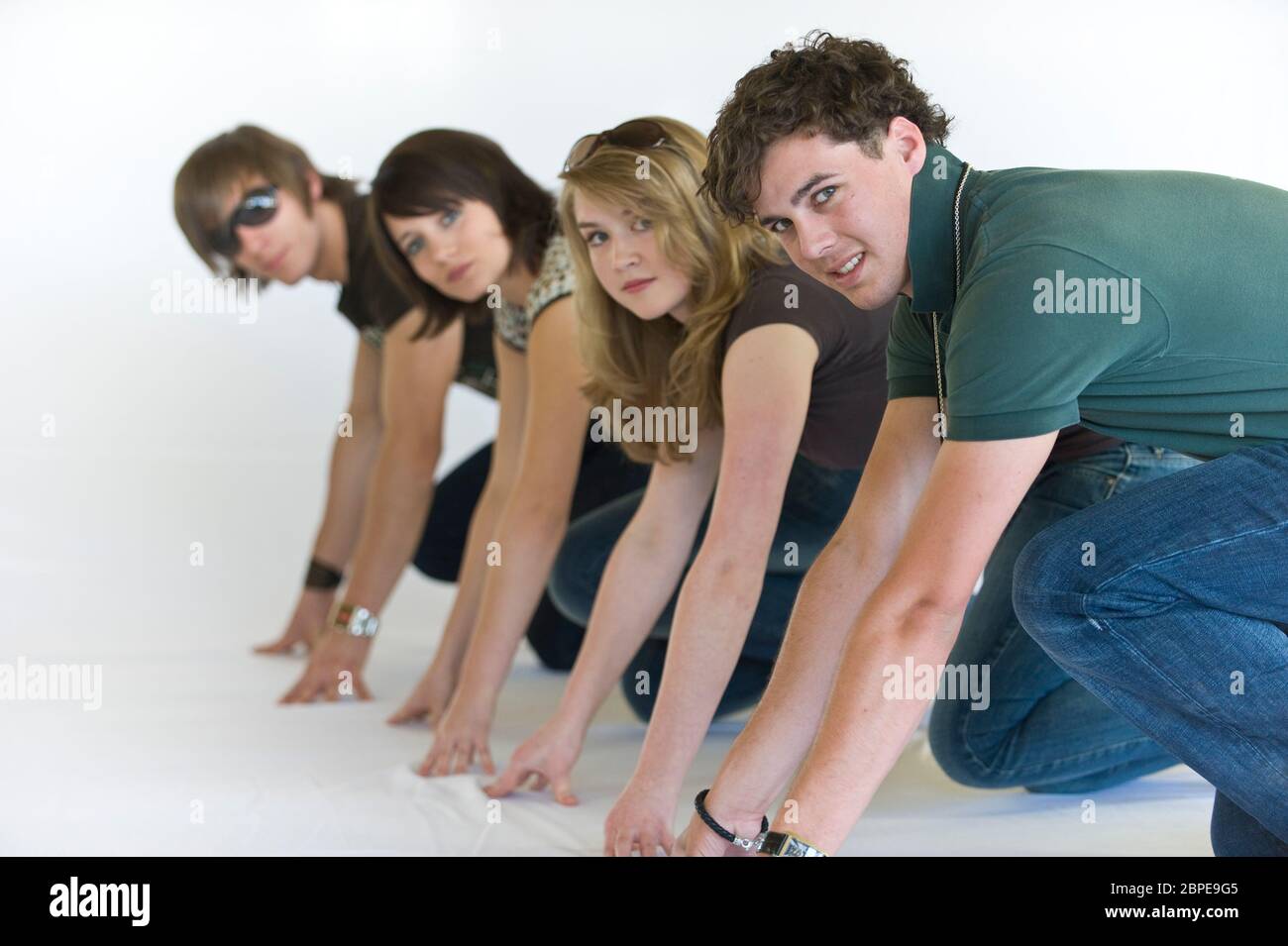 Vier junge Leute starten durch Stock Photo