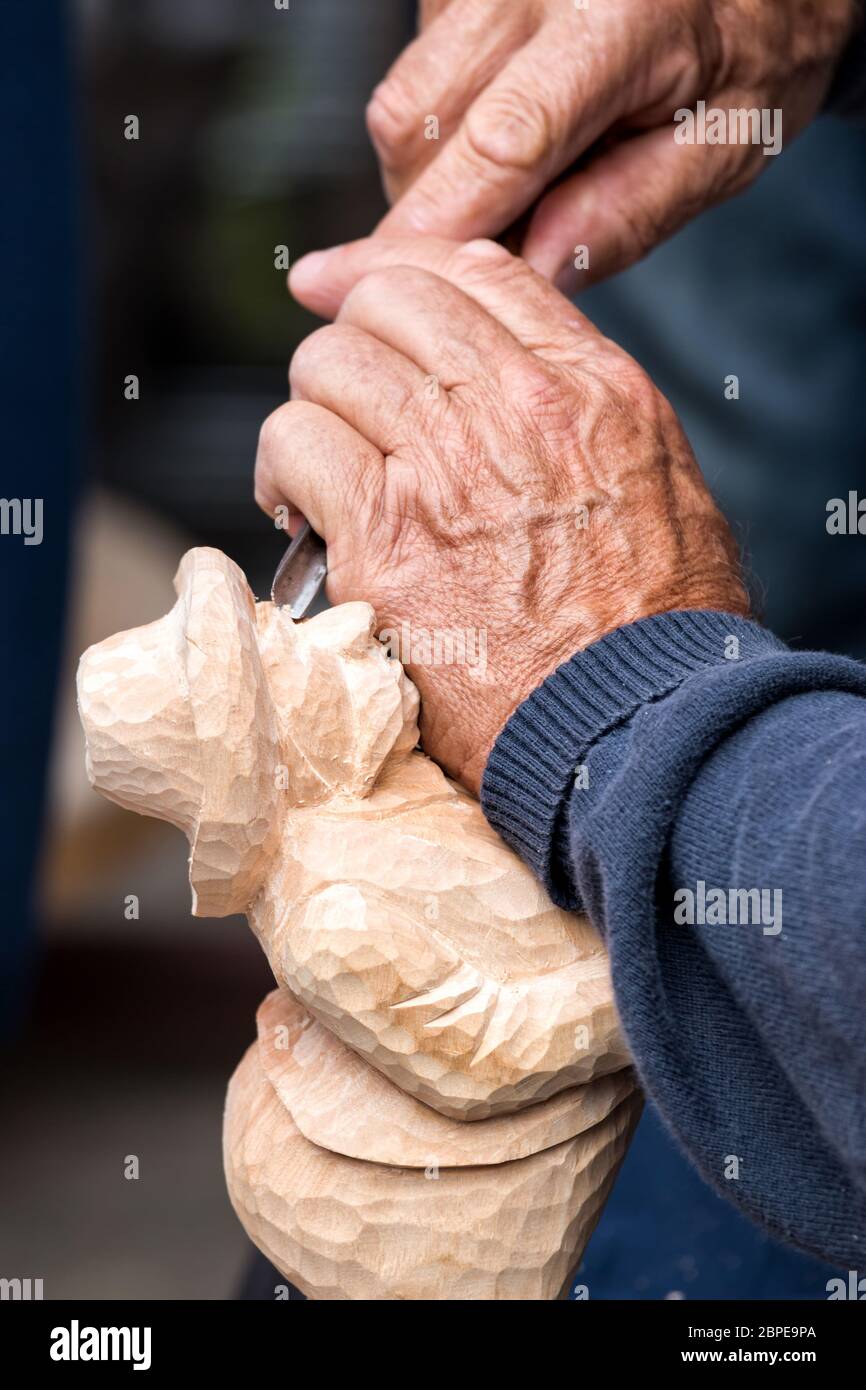 Skilful carver working in a small figure Stock Photo