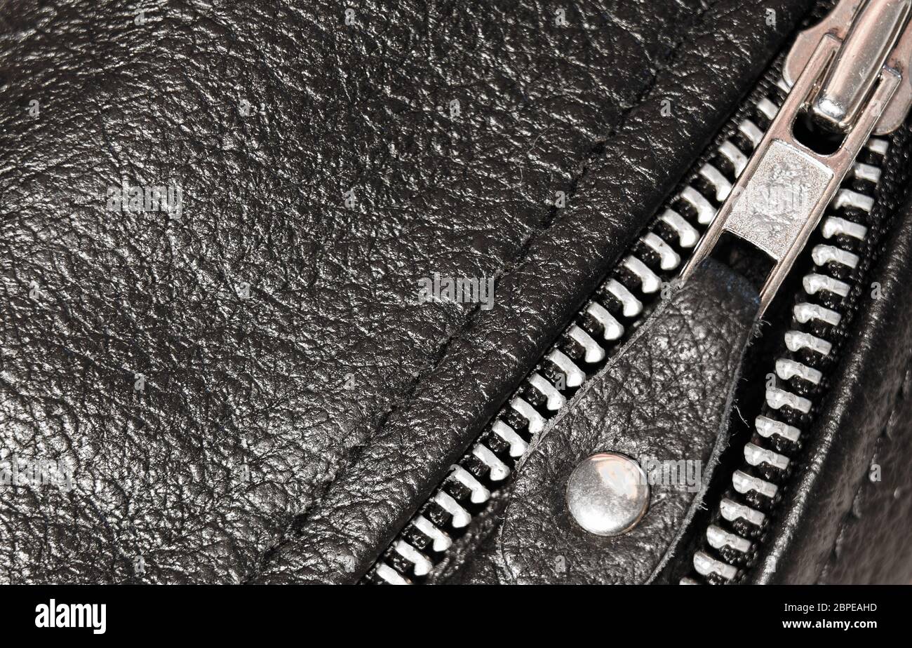 Part black leather clothing with a zipper. macro photo Stock Photo