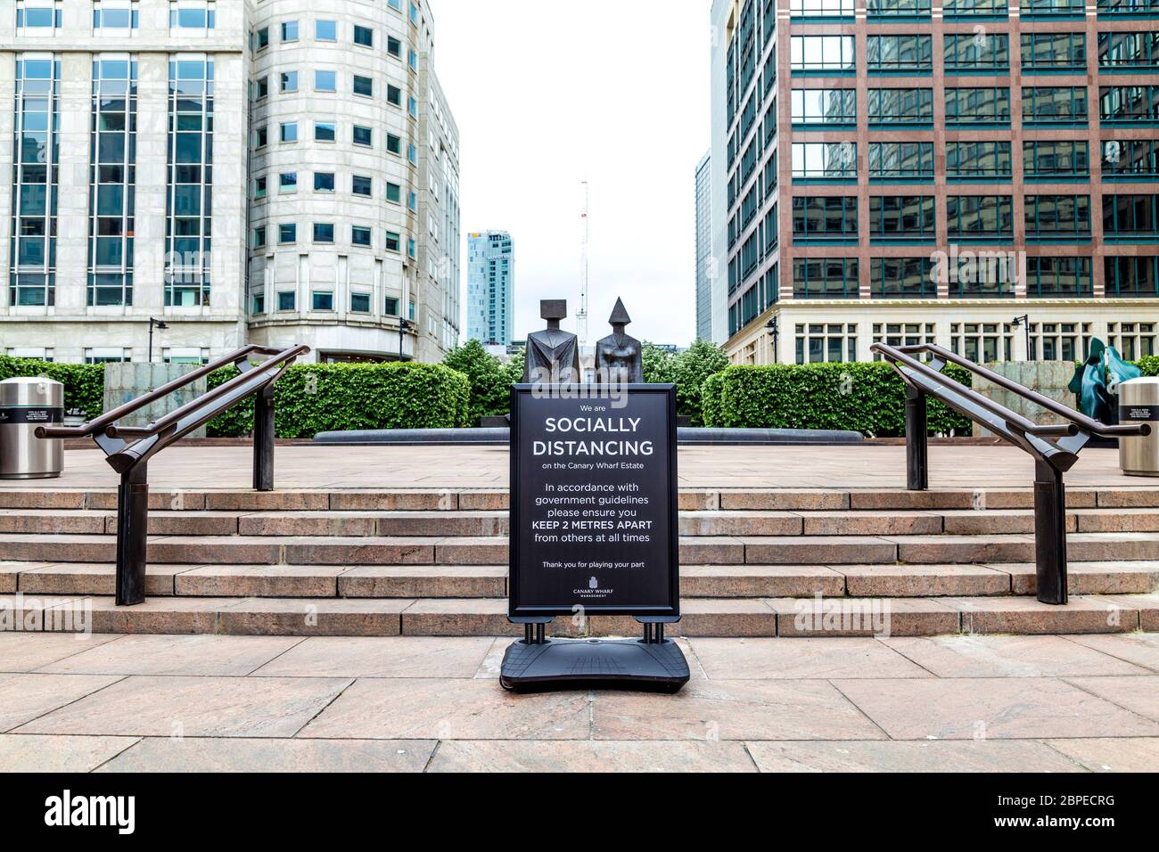 10 May 2020, London, UK - Sign in Canary Wharf asking people to follow government guidelines and keep 2 meters apart during Coronavirus pandemic Stock Photo
