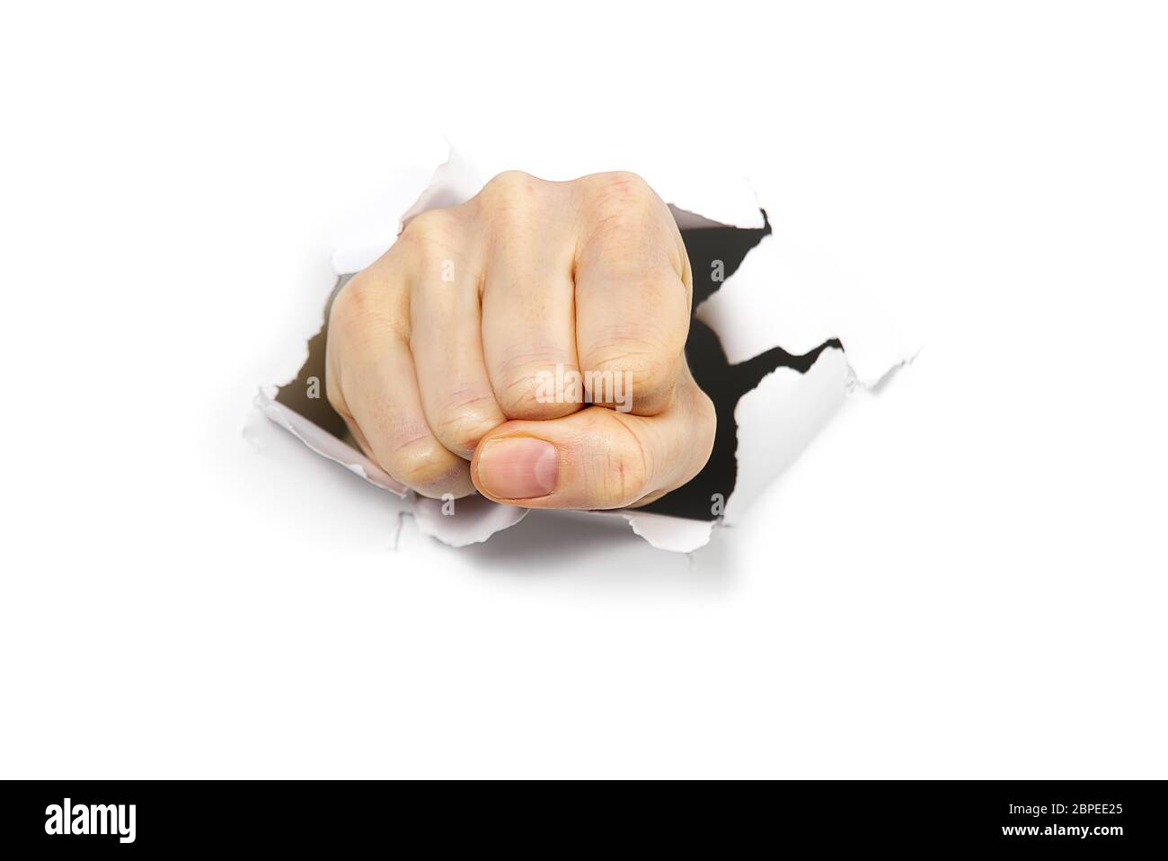 Hand punching through white paper hires stock photography and images Alamy
