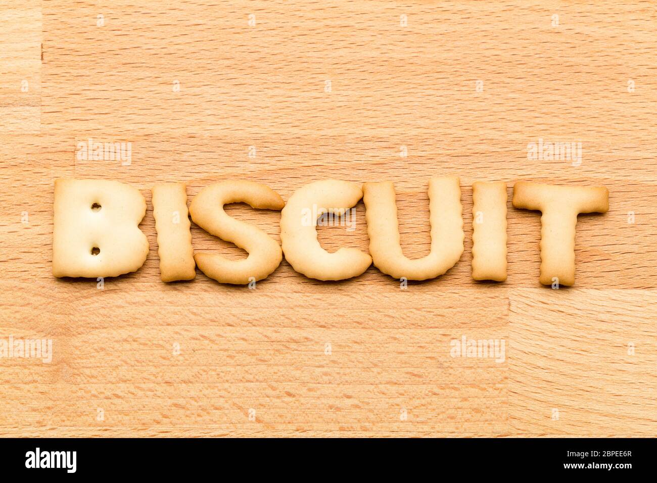 Word biscuit over the wooden background Stock Photo Alamy