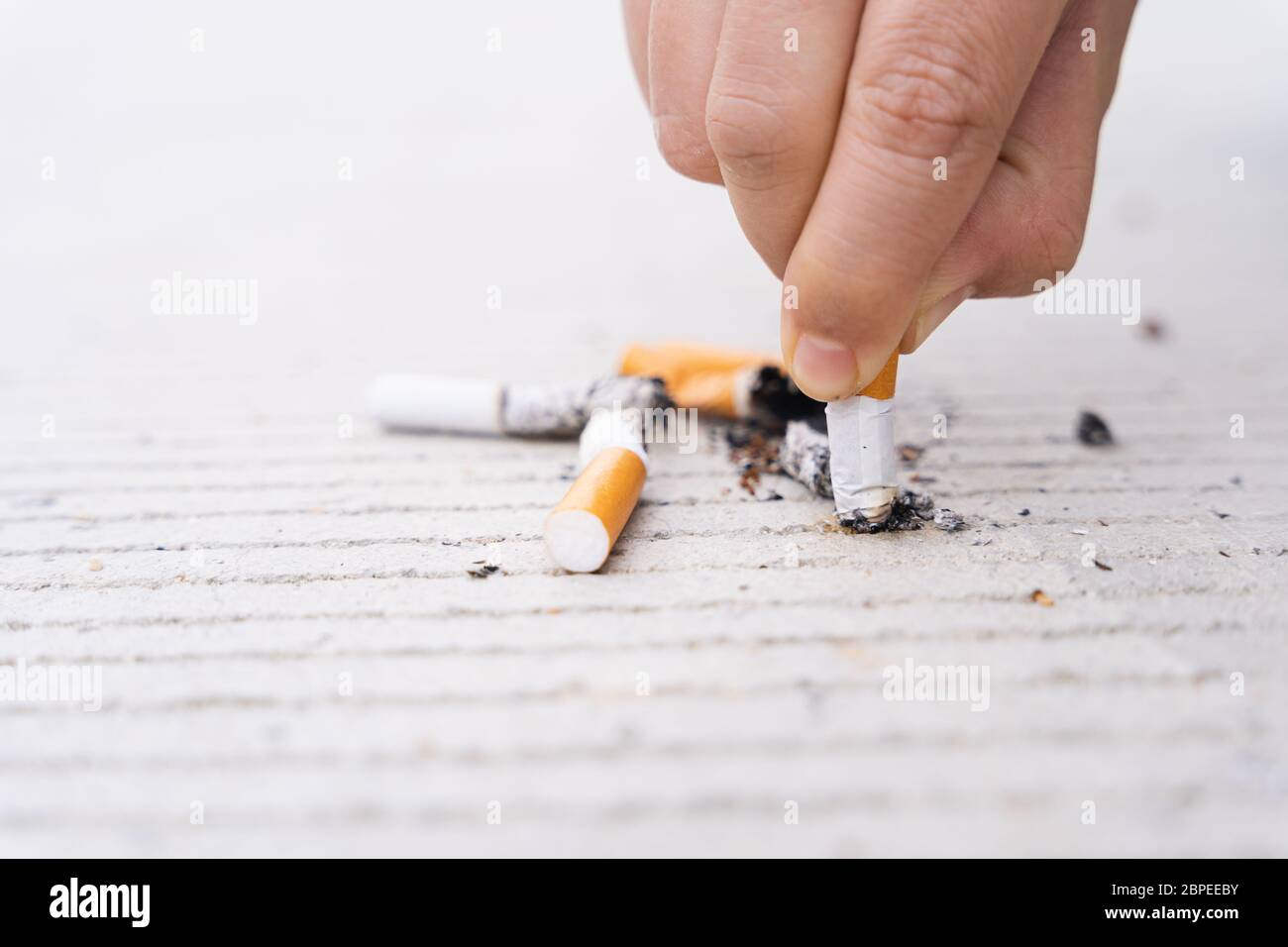 World no tobacco day concept. someone put cigarette on the floor for