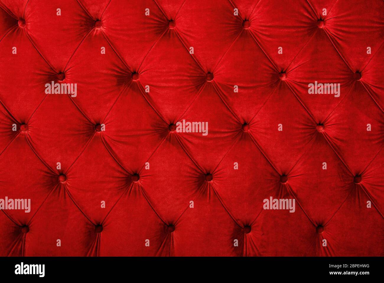 Red velvet capitone textile background, retro Chesterfield style ...