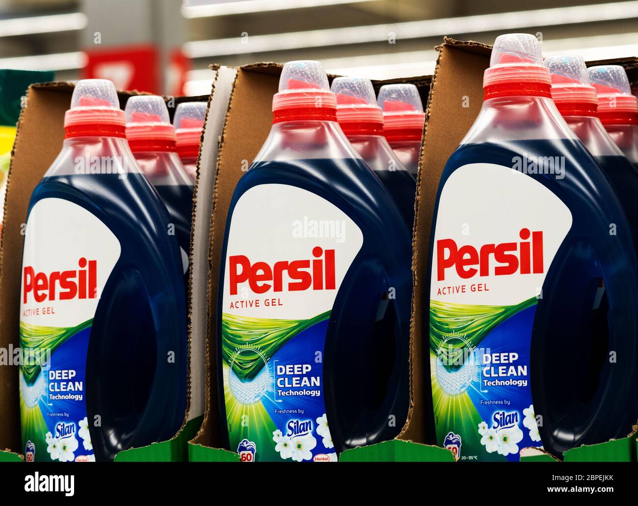 Plastic bottles with detergent for automatic washing machines Persil in the store Stock Photo