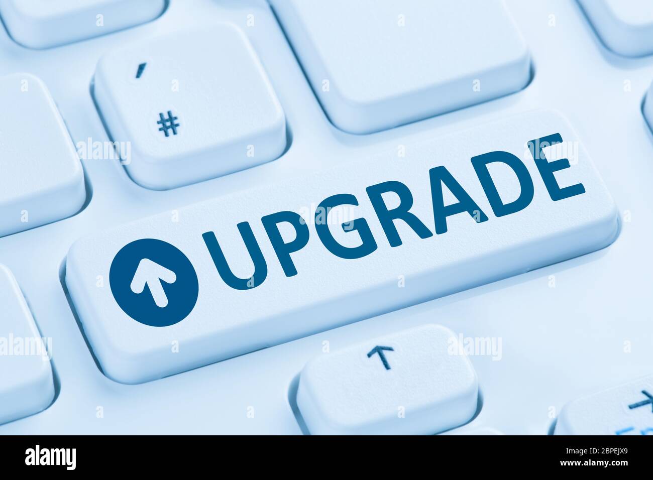 Upgrade upgraden Software Programm Symbol blau Computer Tastatur Stock Photo