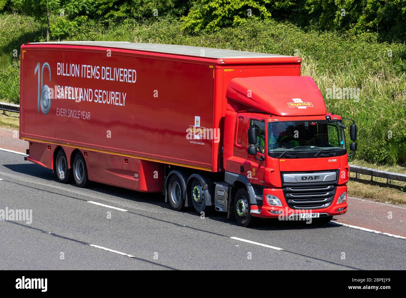 Royal Mail Haulage delivery trucks, lorry, transportation, truck, cargo carrier, DAF vehicle, European commercial transport, industry, M6 at Manchester, UK Stock Photo