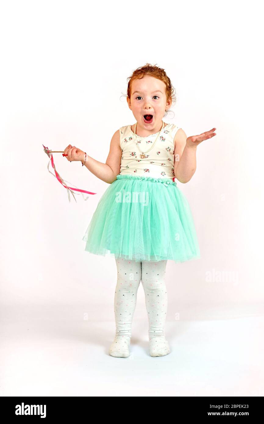 Fashion little girl in green dress, in catwalk model pose, stock photo. Image 02 Stock Photo
