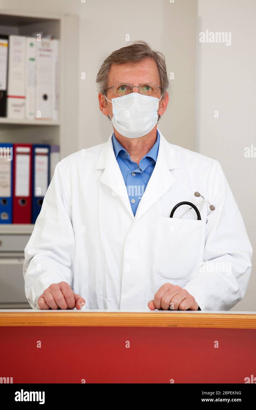 Mature doctor smile portrait hi-res stock photography and images - Alamy