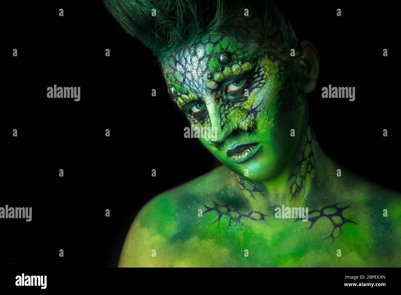 Fantastic Reptilian Girl. Creative Make up like Alien or Superhero Movie. Stock Photo